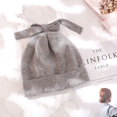 Ženska debela vunena kapa sa trakom