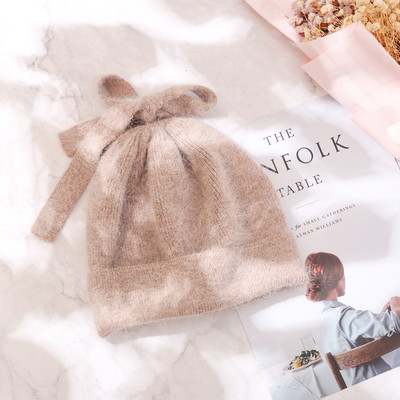 Ženska debela vunena kapa sa trakom