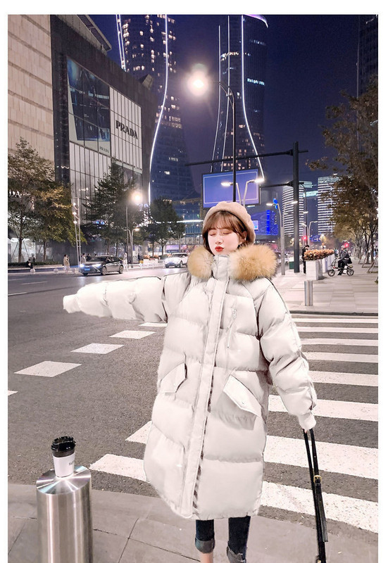 Modern női hosszú kabát toll és kapucnival