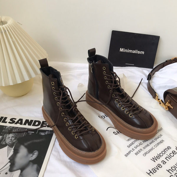 Öko-nahast valmistatud vabaaja naiste saapad pruunide paeltega