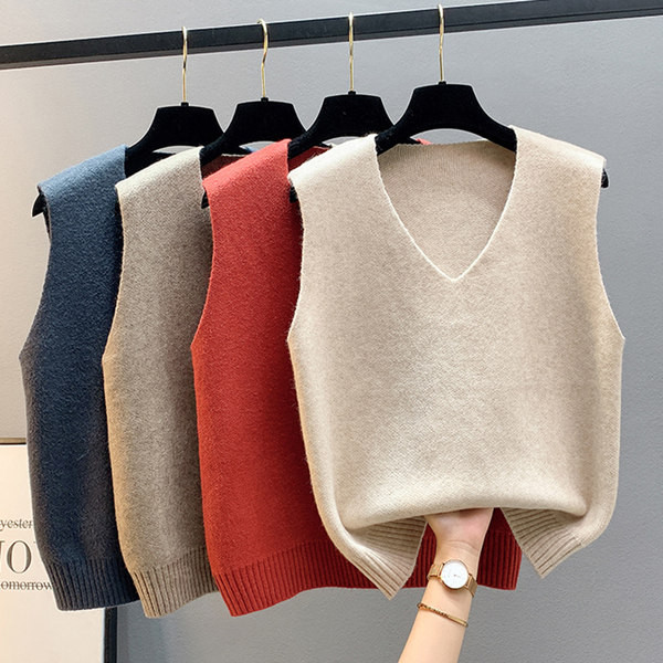 Kötött női mellény vékony kötésből, spitz nyakkivágással