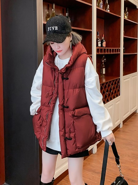 Široki model ženske vestice s kapuljačom - srednje dužine