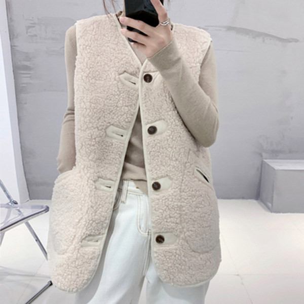 Női kétsoros mellény gombokkal és spitz nyakkivágással