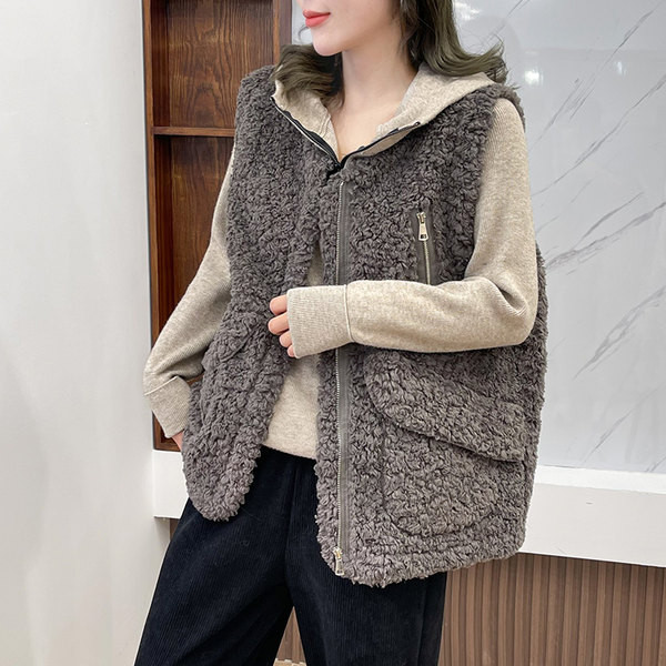 Modern női pehelymellény zsebekkel és spitz nyakkivágással