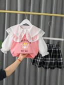 Moekas aplikatsiooniga ruudulisest seelikust ja pluusist tüdrukute komplekt