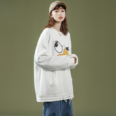 Széles női pulóver mintával és zsebbel