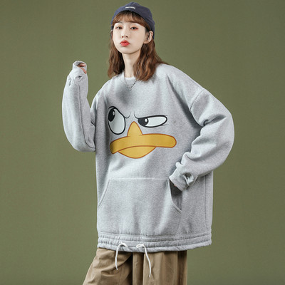 Széles női pulóver mintával és zsebbel