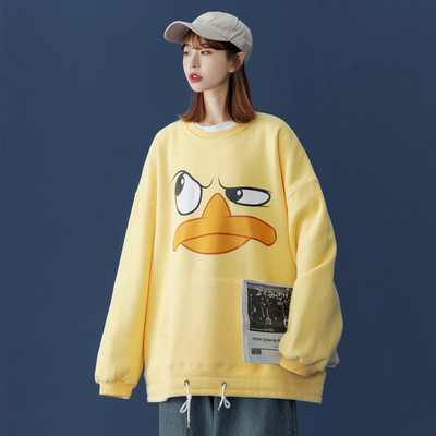 Széles női pulóver mintával és zsebbel