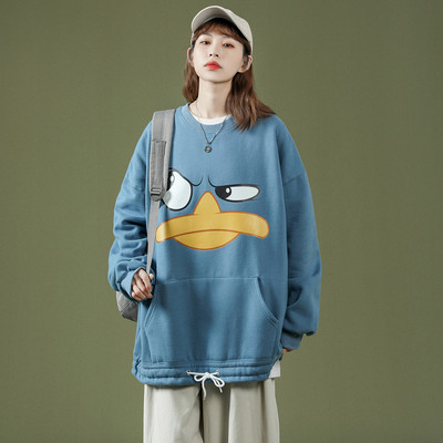 Széles női pulóver mintával és zsebbel