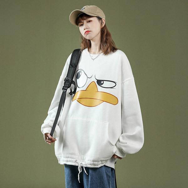 Széles női pulóver mintával és zsebbel