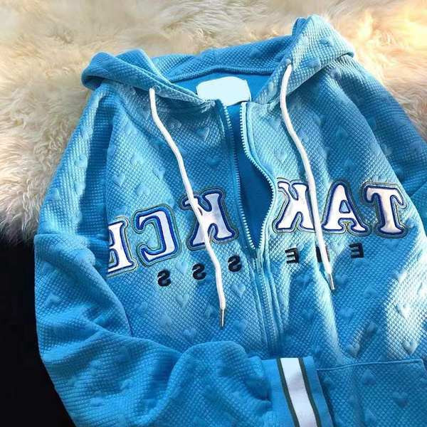 Kevadine naiste dressipluus kirja ja kapuutsiga