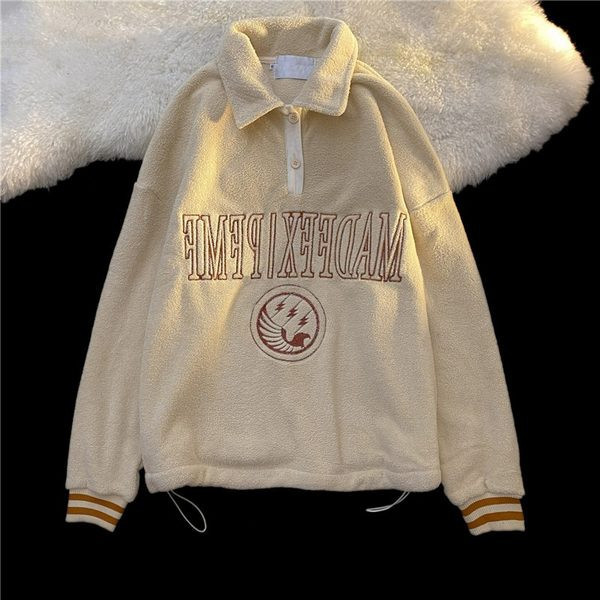 Plüüsis naiste dressipluus tikitud teksti ja nööpidega