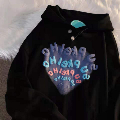 Modern női pulóver mintával és kapucnival