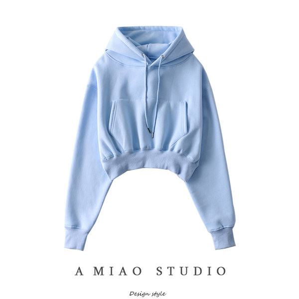 Női pulóver kapucnival és gumival