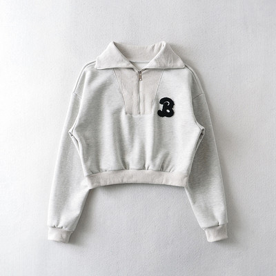 Lühikese mudeliga naiste dressipluus luku ja tikandiga