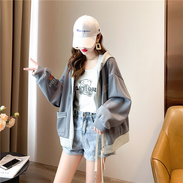 Naiste lai tasku ja tõmblukuga dressipluus