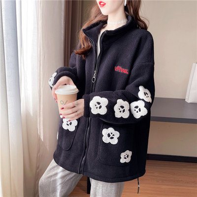 Női széles pulóver mély zsebekkel és cipzárral