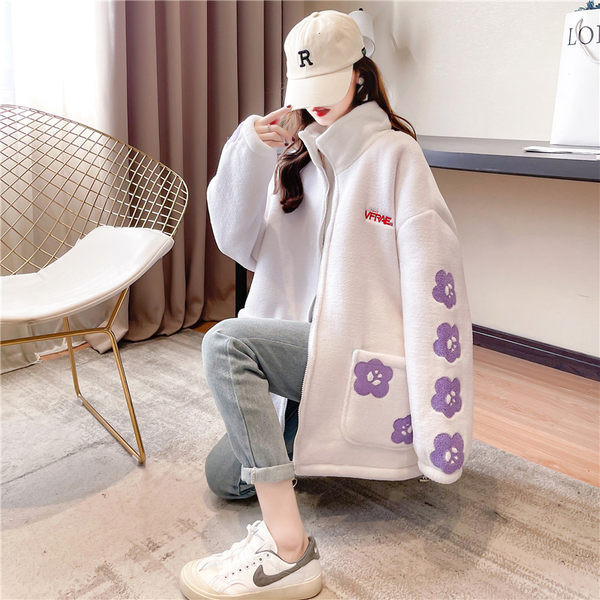 Női széles pulóver mély zsebekkel és cipzárral