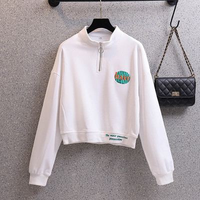 Rövid női pulóver cipzárral és színes mintával