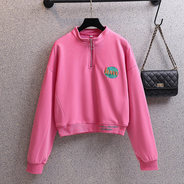 Rövid női pulóver cipzárral és színes mintával