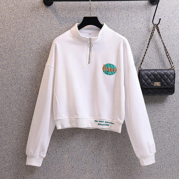 Rövid női pulóver cipzárral és színes mintával