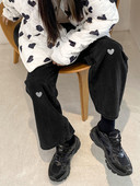 Laia mudeliaplikatsiooniga ühevärvilised naiste teksad