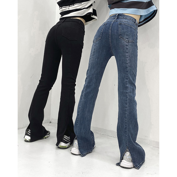 Naiste ühevärvilised standardse vöökoha ja rebenenud motiividega teksad