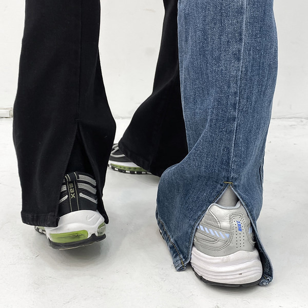 Naiste ühevärvilised standardse vöökoha ja rebenenud motiividega teksad