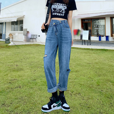 Naiste kõrge vöökohaga teksapükste lai, rebitud motiividega mudel