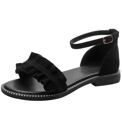 Uus lokkide ja lameda tallaga sandaalide mudel