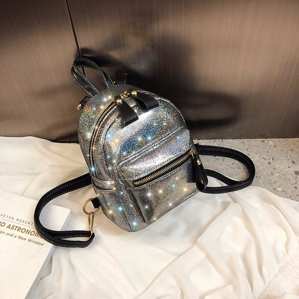 Kahes värvitoonis läikiva efektiga naiste seljakott