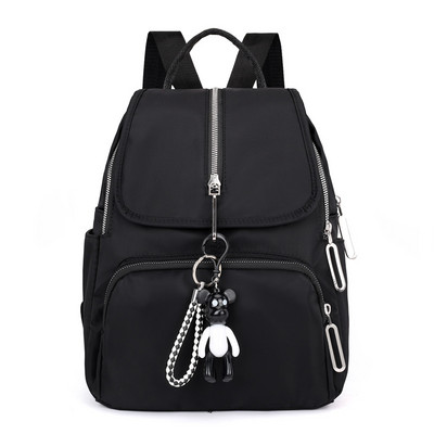 Moodne naiste tekstiilist seljakott eesmise lukuga