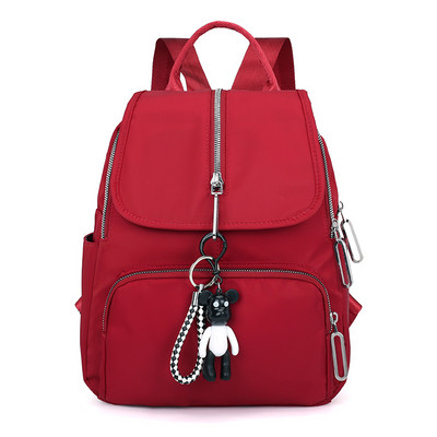 Moodne naiste tekstiilist seljakott eesmise lukuga