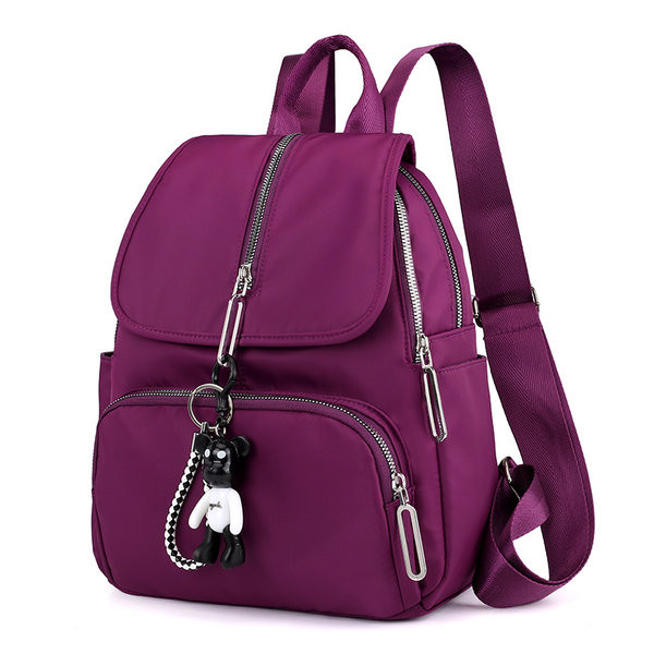 Moodne naiste tekstiilist seljakott eesmise lukuga