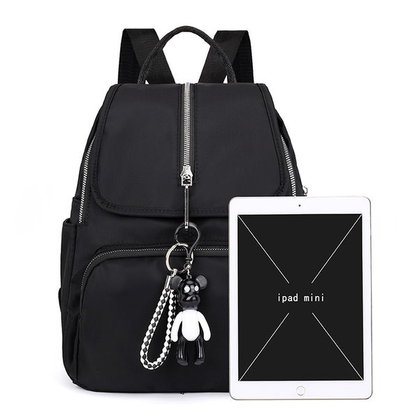 Moodne naiste tekstiilist seljakott eesmise lukuga