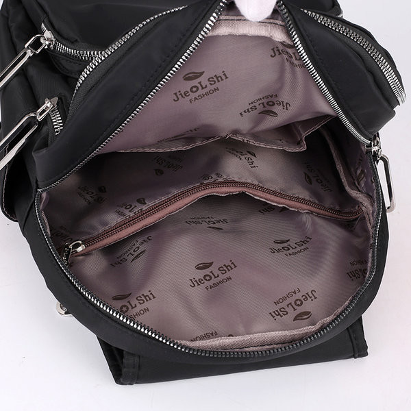 Moodne naiste tekstiilist seljakott eesmise lukuga