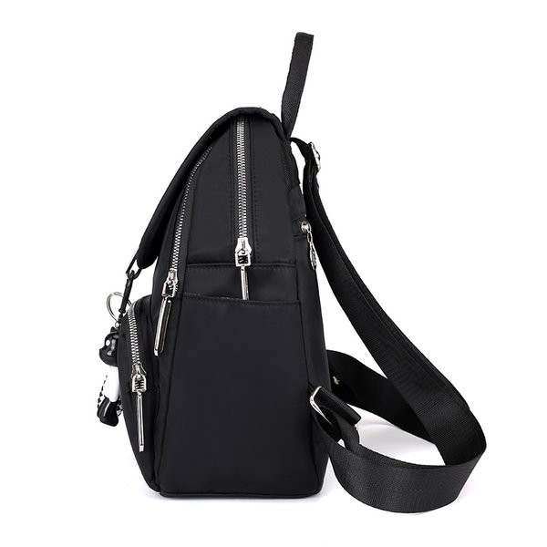 Moodne naiste tekstiilist seljakott eesmise lukuga