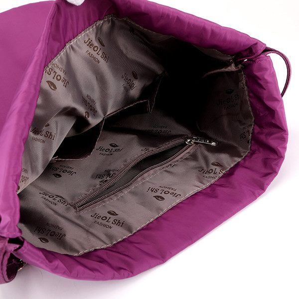 Naiste tekstiilist seljakoti tüüpi kott