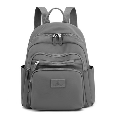 Naiste tekstiilist seljakott taskutega mitmes värvitoonis