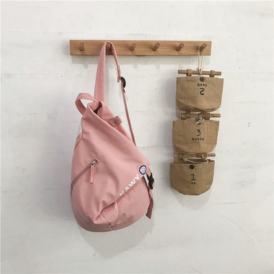 Υφασμάτινο unisex σακίδιο πλάτης με ασύμμετρο κούμπωμα