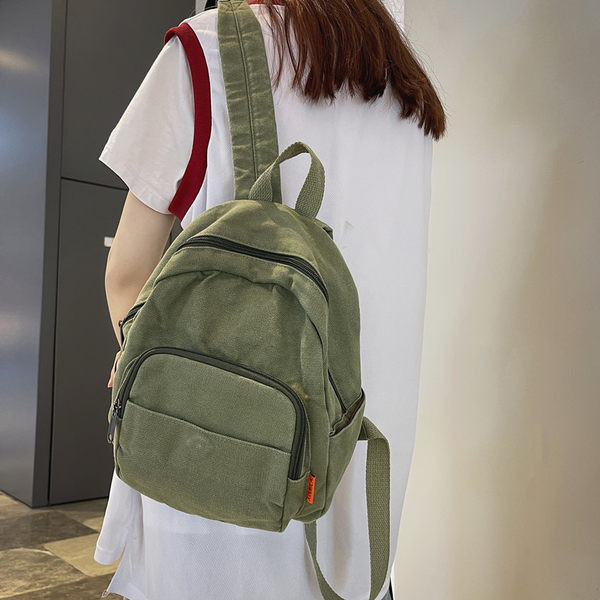 Väike tekstiilist seljakott mitme lahtriga