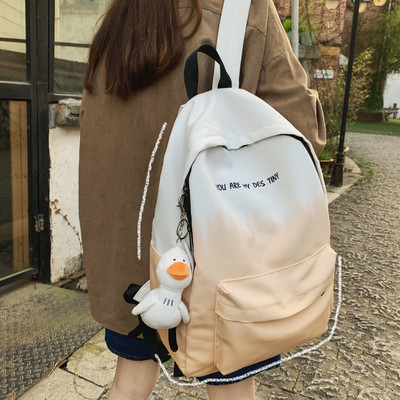 Naiste igapäevane tekstiilist seljakott kirjaga