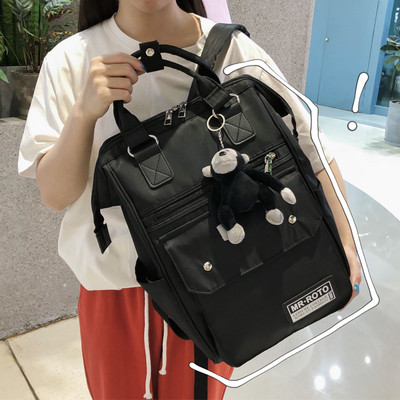 Ruudukujuline multifunktsionaalne tekstiilist seljakott ja võtmehoidja