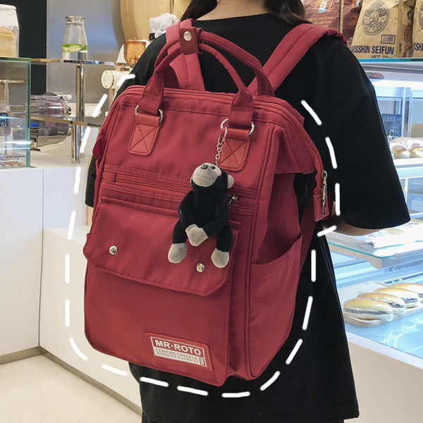 Ruudukujuline multifunktsionaalne tekstiilist seljakott ja võtmehoidja