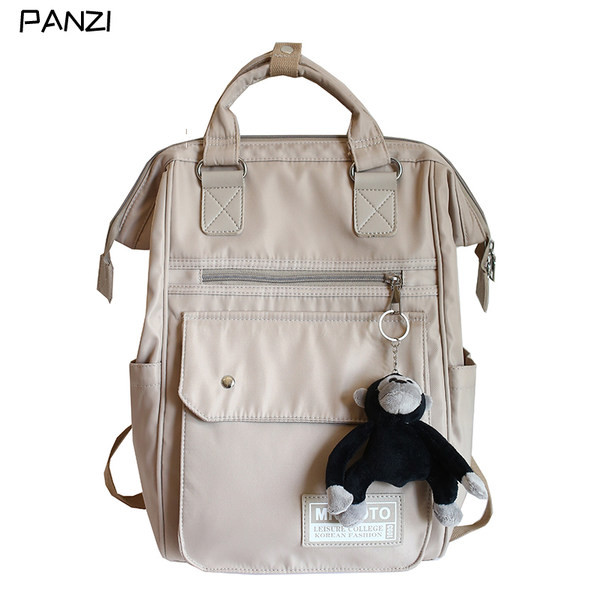 Ruudukujuline multifunktsionaalne tekstiilist seljakott ja võtmehoidja