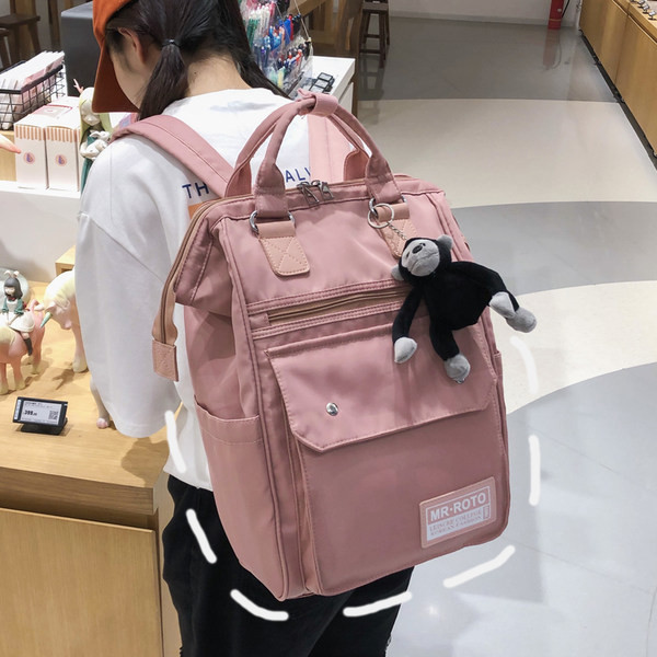 Ruudukujuline multifunktsionaalne tekstiilist seljakott ja võtmehoidja