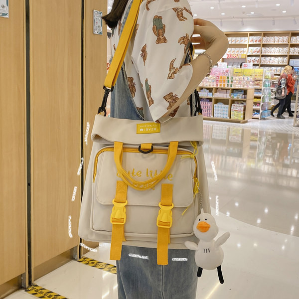 Naiste tekstiilist tikandiga seljakott - mitut värvi