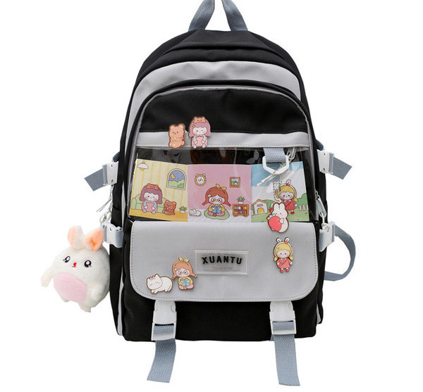 Moodne kooli seljakott luku ja tekstiilist pandlaga