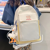 Esitasku ja laiade rihmadega tekstiilist seljakott naistele