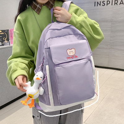 Esitasku ja laiade rihmadega tekstiilist seljakott naistele